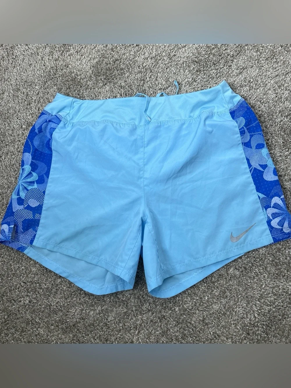 Nike girl’s Light Blue Athletic Shorts with Dark Blue Floral Panels
